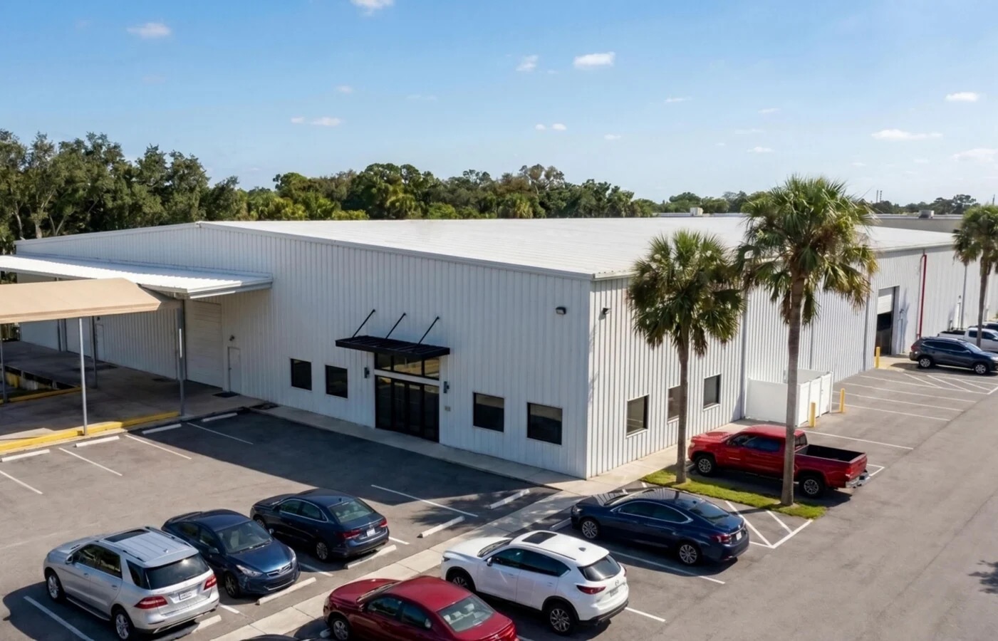 Entrance elevation and striped parking field — 198 Lock Road, Deerfield Beach, FL